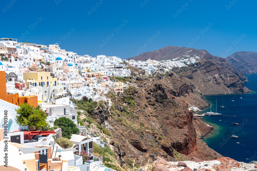 Panorama of Santorini island. Colorful spring view of famous Greek resort Fira, Greece, Europe. Traveling concept background. Vivid colors.