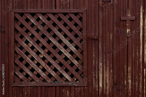 A Catholic wooden confession booth, empty, in close range, old one. Religion concept