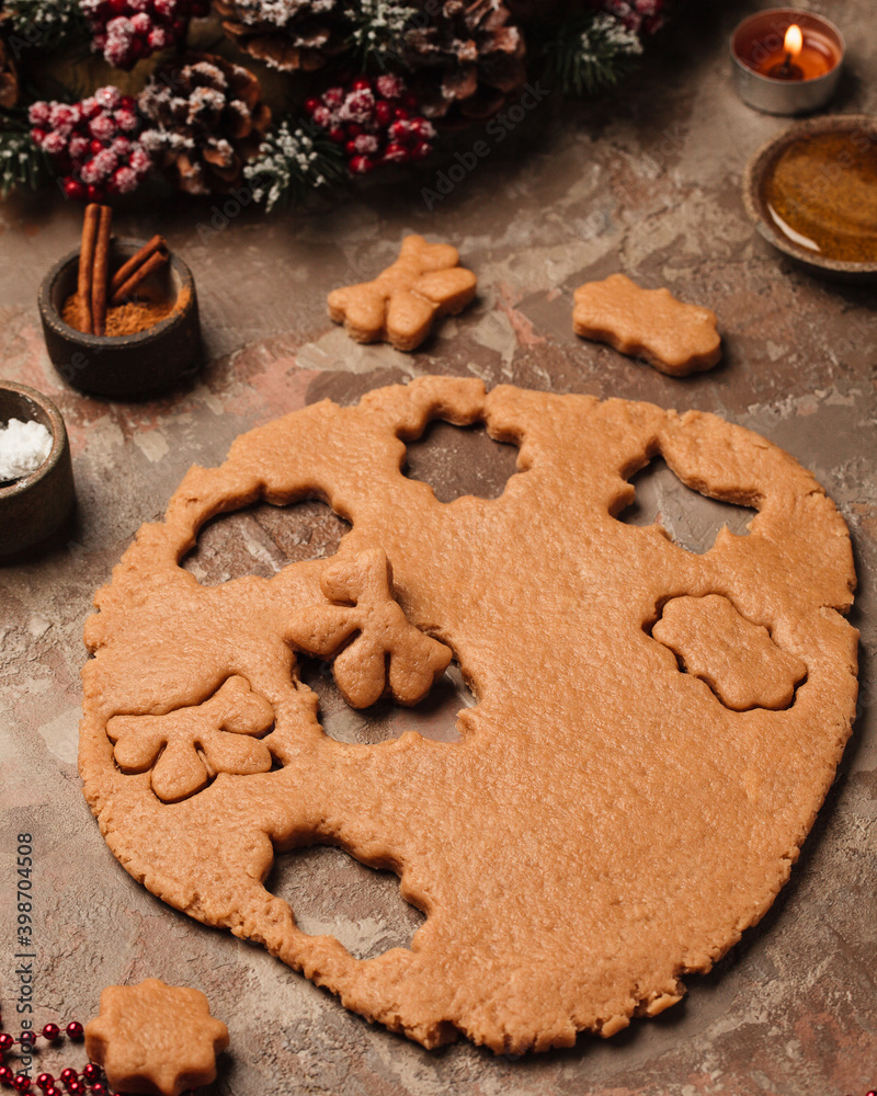 Cooking new year's ginger cookies. Christmas tree on the table with candles. Cooking new year's ginger cookies. Christmas tree on the table with candles.