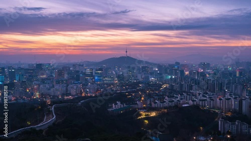 Time Lapse Beautiful sunrise of Seoul,cityscapse at inwangsan mountain in South Korea.Zoom out photo