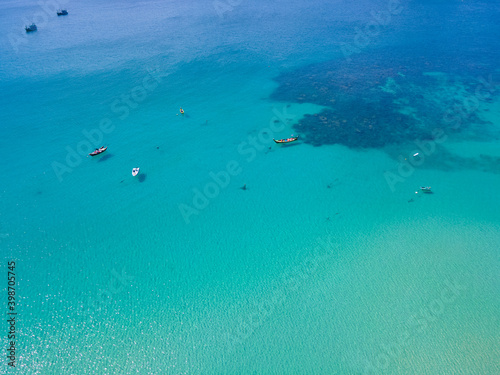 Aerial view Nature sea. Turquoise Sea and White beach sand in copy space, Aerial view of drone, Seawater clear and blue green. Nature in Khai Island. At Khai island, Phuket, Thailand. Travel concept.