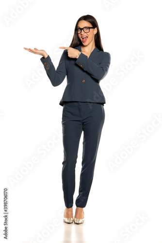 beautifu advertizing business woman in a pants and jacket