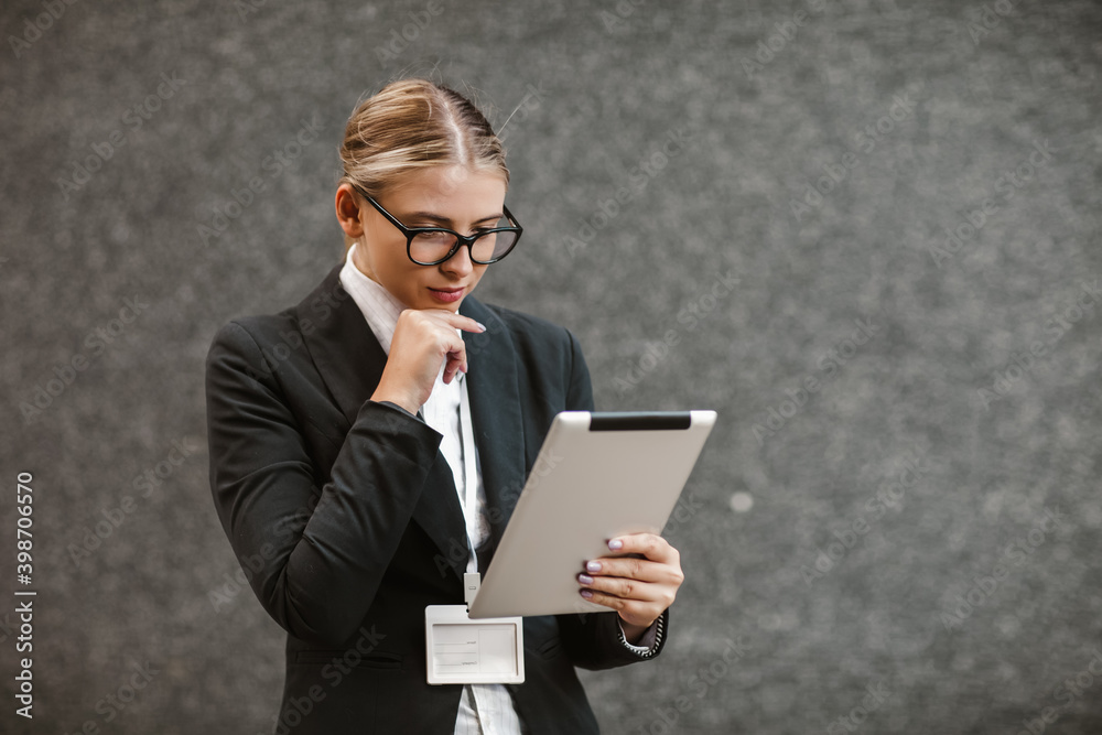 Portrait of successful businesswoman holding digital tablet Portrait of successful businesswoman holding digital tablet