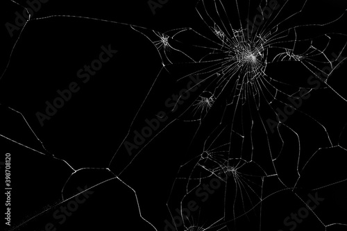Broken glass on black background. Texture backdrop object design. Abstract cracked screen. 