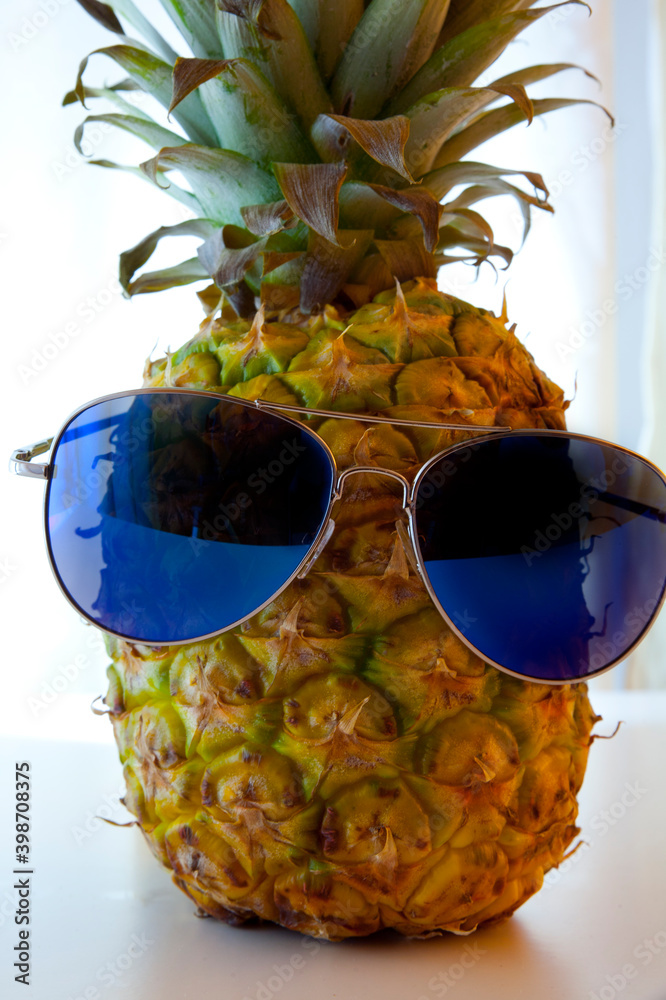 Pineapple with sunglasses.Because the pineapple is a tropical fruit