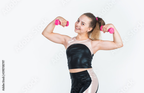 small girl training with barbells. sport and fitness. teen girl hold dumbbell. sportswear and equipment shop. healthy lifestyle. dieting for kids. child workout in gym isolated on white