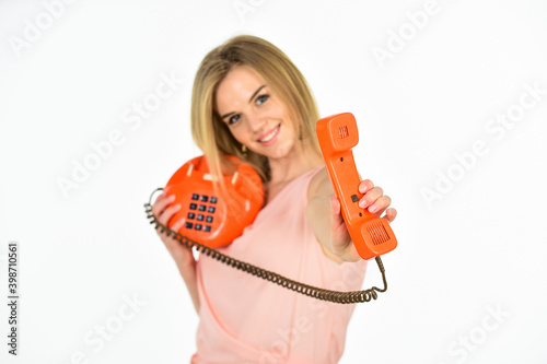 Call me. Outdated gadgets. Call business office. Adorable woman interlocutor. Interlocutor concept. Old fashioned secretary. Happy girl hold phone. Playful interlocutor. Administrator answers phone
