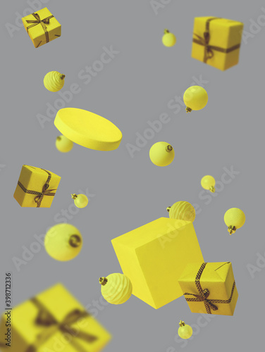 Christmas flying decorations with geometric podiums, baubles and gift boxes in colors of the year 2021. Ultimate gray and illuminating yellow. New year card with levitation