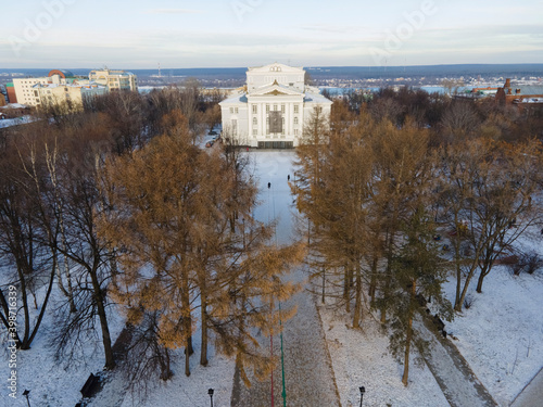 Aerial view of thetre of opera and ballet in perm, winter with trees in the foreground