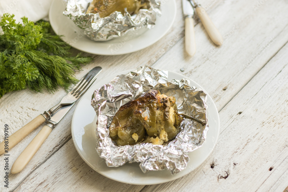 Peppers stuffed with cottage cheese, cheese, herbs and garlic, baked in foil. Delicious healthy food without meat