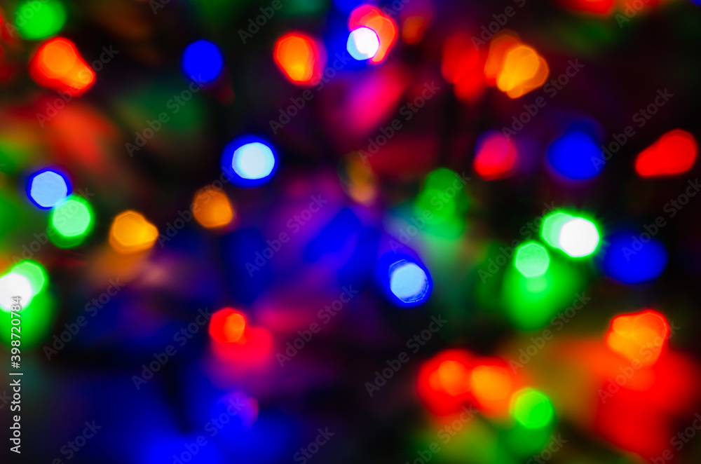 Abstract pattern of colorful bokeh lights on dark background