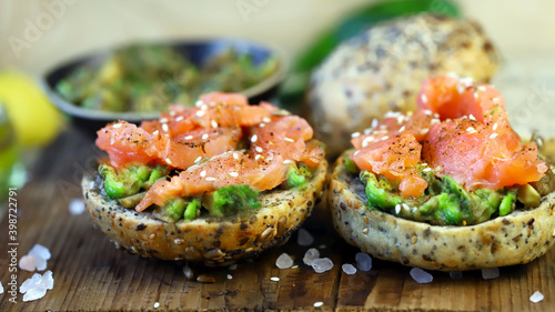 Salmon avocado sandwiches on healthy seed buns. Healthy snack. The keto diet.