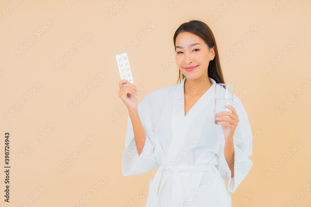 Portrait beautiful young asian woman with water glass and drug pill Portrait beautiful young asian woman with water glass and drug pill