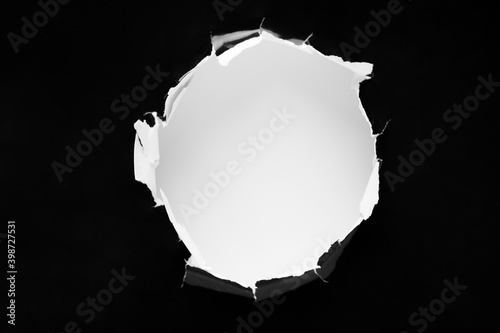 Vászonkép black Hole in the paper with torn sides.