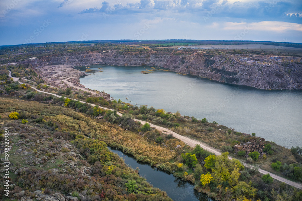 Old flooded stone quarry, site of natural granite stone mining