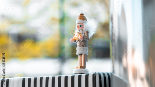 Nutcracker standing alone on top of present 