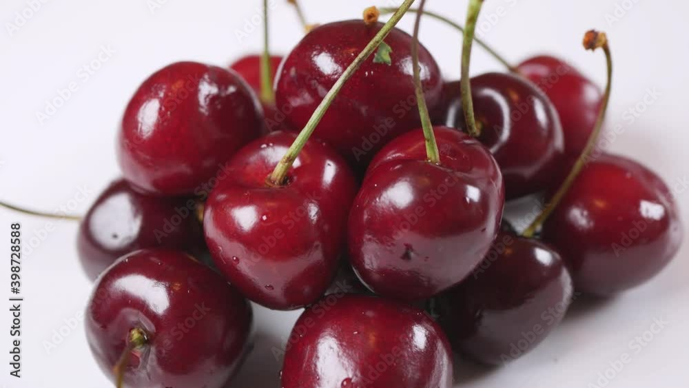 Fresh juicy red cherry berry rotate on white background. Side view Fresh juicy red cherry berry rotate on white background. Side view