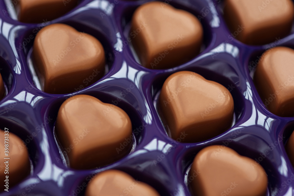 Close-up chocolates hearts on box. Top view. Valentines day celebration concept Close-up chocolates hearts on box. Top view. Valentines day celebration concept