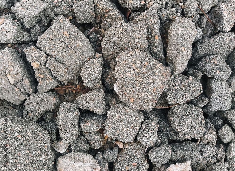 Texture, background of the destroyed, old, cracked in pieces of gray asphalt. Road works, earthquake underground. Texture, background of the destroyed, old, cracked in pieces of gray asphalt. Road works, earthquake underground.
