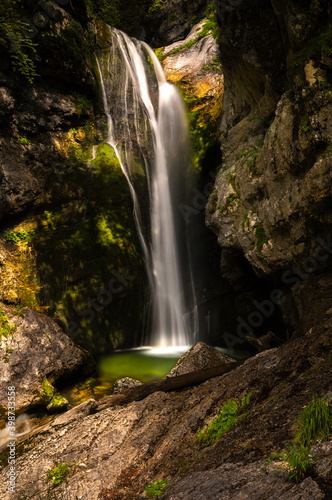 Fototapeta Naklejka Na Ścianę i Meble -  Slap Mostnice, also called Slap Voje or Slap Šum, is one of the many waterfalls in Korita Mostnice (Korita gorge) near lake Bohinj, at Stara Fuzina, Triglav National Park, Slovenia.