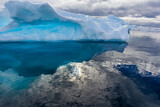 Gentle waters surround Antarctica with large floating icebergs