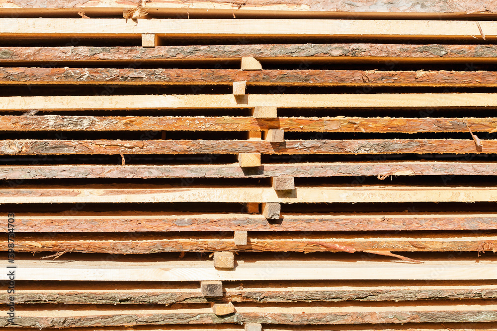Stacked boards. Industrial background from stack wood.