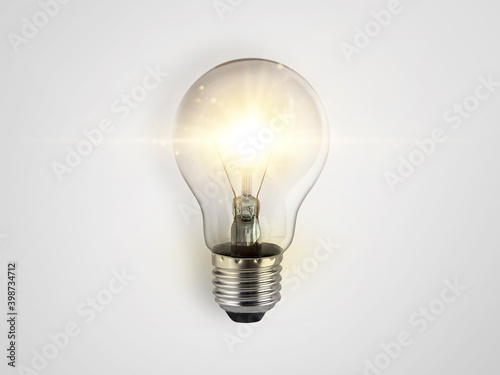 concept creativity with bulbs that shine glitter on white background