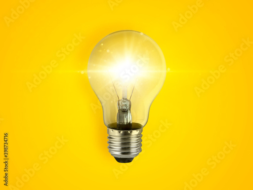 фотографія concept creativity with bulbs that shine glitter on yellow background