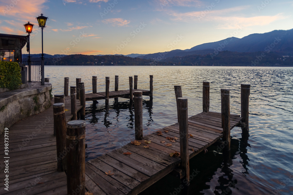 Wooden pier on lake Orta, Piedmont, Italy Wooden pier on lake Orta, Piedmont, Italy