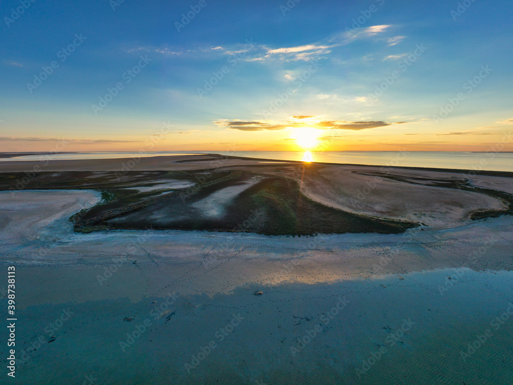Unusual islands on a brilliant lake and colorful sunset Unusual islands on a brilliant lake and colorful sunset