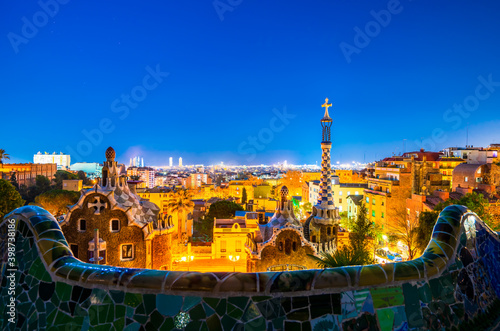 Barcelona at night seen from Park Guell. Park was built from 1900 to 1914 and was officially opened as a public park in 1926. In 1984, UNESCO declared the park a World Heritage Site