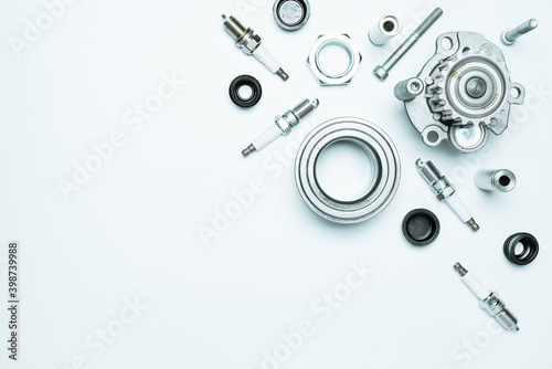 Auto equipment. Auto motor mechanic spare or automotive piece on white background. Set of new metal car part. Repair and vehicle service with space for text.