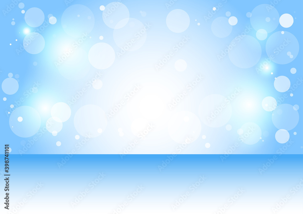 Blue background with white bokeh with festive Christmas and New Year.