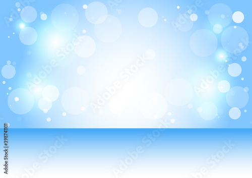 Blue background with white bokeh with festive Christmas and New Year.