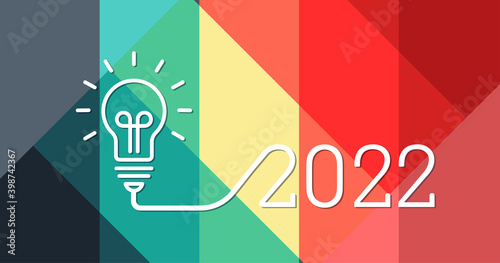 Creativity light bulb idea with 2022 new year design with a light bulb on the abstract color pattern background. 2022 planning ideas. Business, glowing