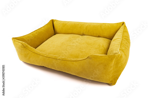 Empty yellow dog bed on a white background. Angle view.