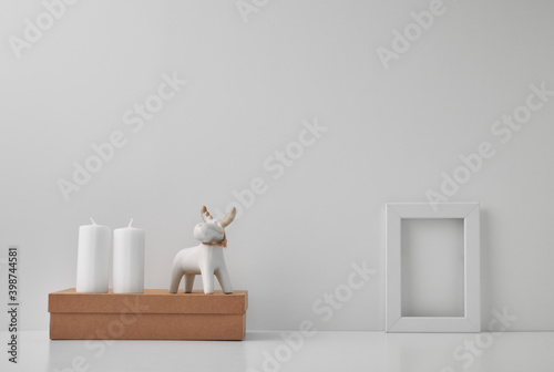 Porcelain figurine of a New Year s deer and New Year s  festive decor. Copy space  mock up.