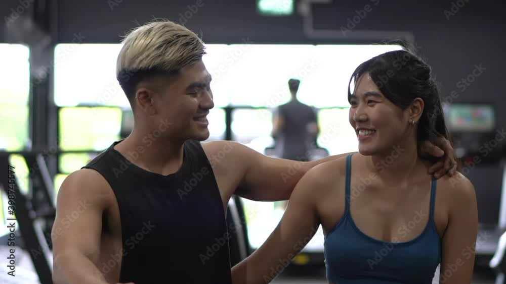 Asian happy couple in gym. Asian happy couple in gym.