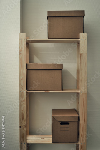 Paper boxes are on a wooden rack. Archive storage  use of eco-friendly materials