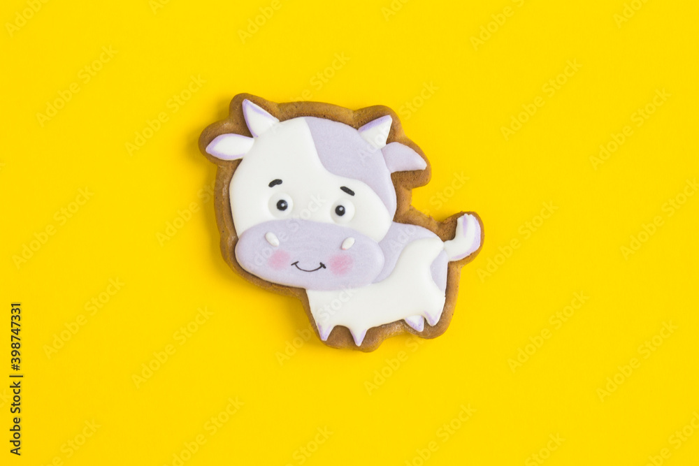 Top view of gingerbread bull on the yellow background Top view of gingerbread bull on the yellow background