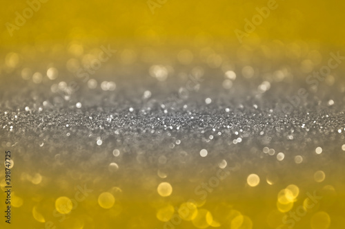 lluminating Yellow and Ultimate Gray background. Color of the year 2021 abstract background with selective focus in the middle. glitter bokeh vintage lights, Happy holiday new year, defocused.
