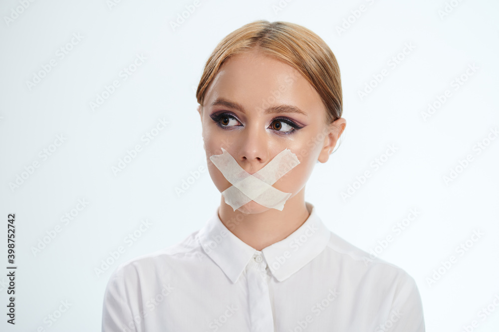 © PixieMe - Portrait of girl with tape on mouth