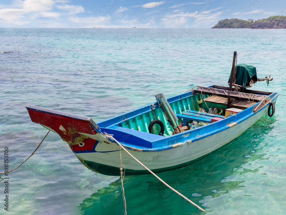 Vietnamese fishing boat anchor near shore