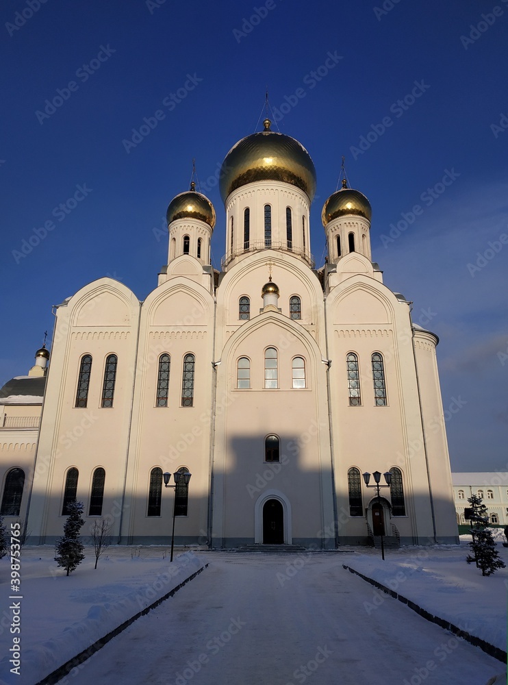 
White orthodox cathedral with golden domes
