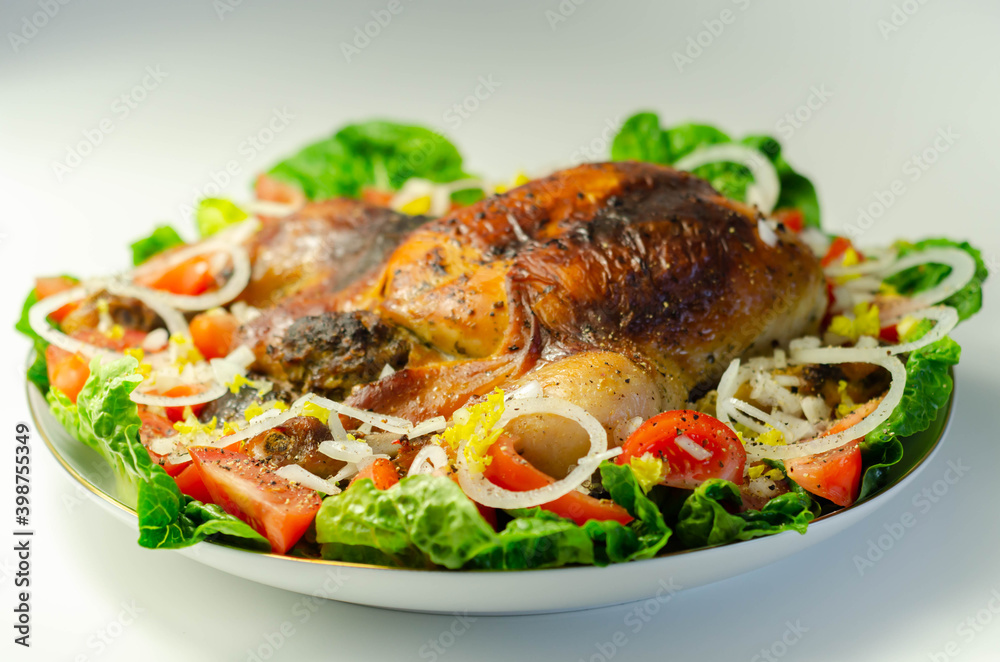 Roasted British large chicken with classic pork, sage, and onion stuffing served with little gem lettuce, tomato, and fresh onion Roasted British large chicken with classic pork, sage, and onion stuffing served with little gem lettuce, tomato, and fresh onion