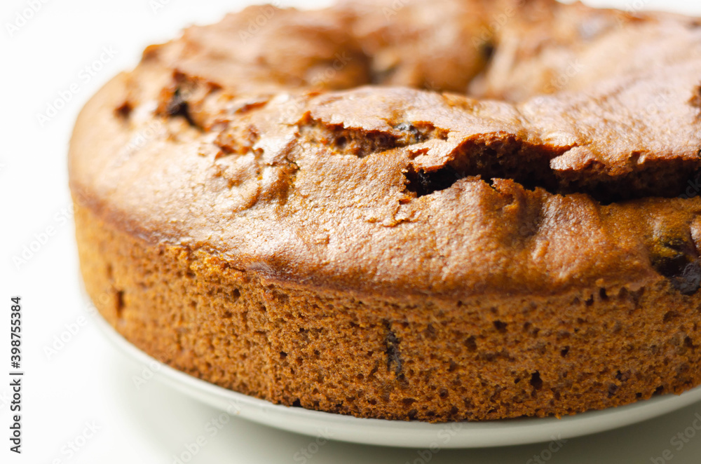 Freshly made spiced fruit ring loaf cake  on the white  background
