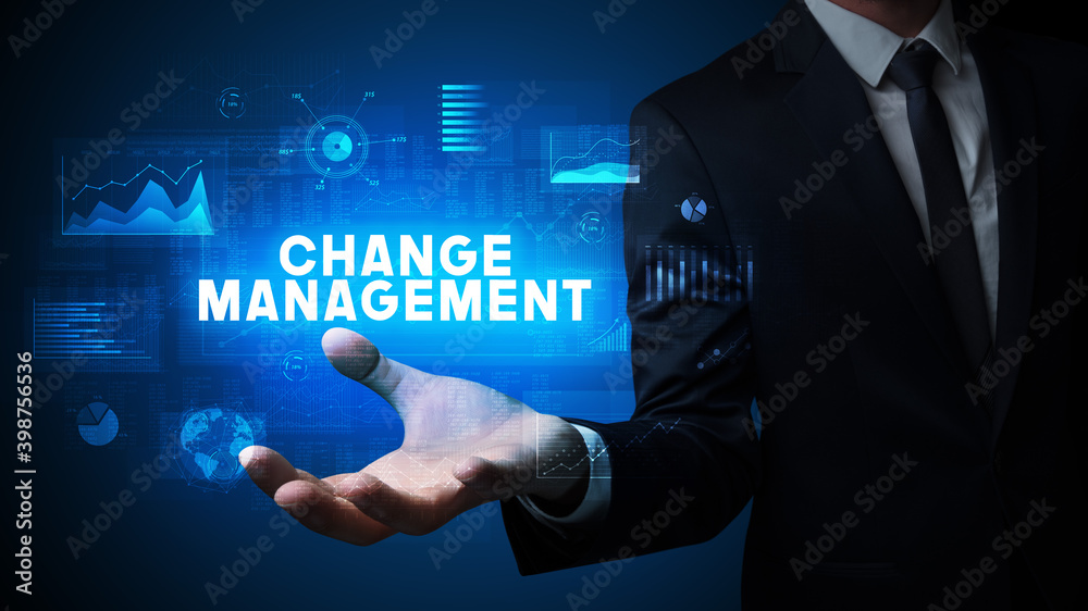 Hand of Businessman holding CHANGE MANAGEMENT inscription, business success concept Hand of Businessman holding CHANGE MANAGEMENT inscription, business success concept
