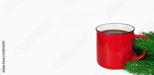 Red mug with coffee, tea or cocoa, isolated on white background, with Christmas tree. Christmas or New Years concept. Copy space