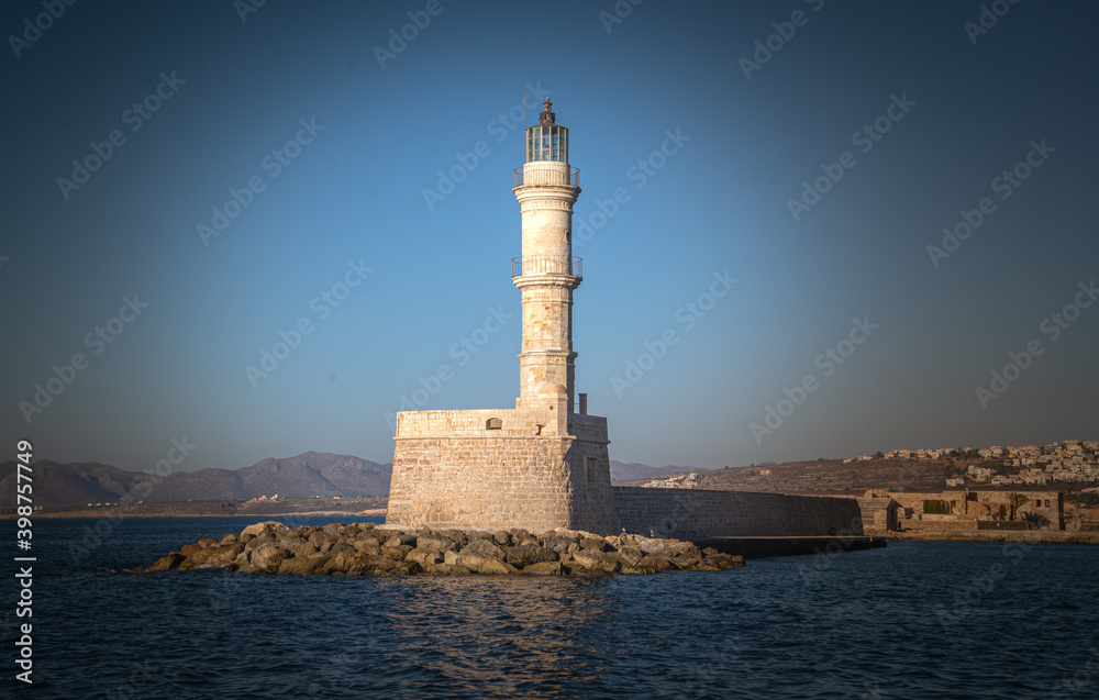 Panorama of Lighthouse in old harbour of Chania at sunset, Crete, Greece