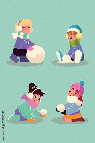 happy girls playing with the snowballs in winter season